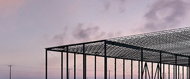 construction site of a commercial building with the structure framing in progress